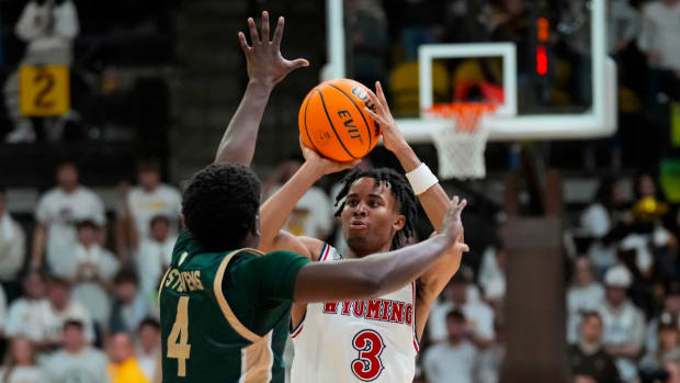 Jan 27, 2024; Laramie, Wyoming, USA; Wyoming Cowboys guard Sam Griffin (3) shoots against Colorado State Rams forward Isaiah Stevens (4) during overtime at Arena-Auditorium.